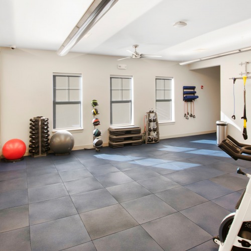 Spin Room Spin room with wall mirrors, a TV, and Pelaton Bikes