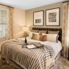 Bedroom with windows and neutral wall paint